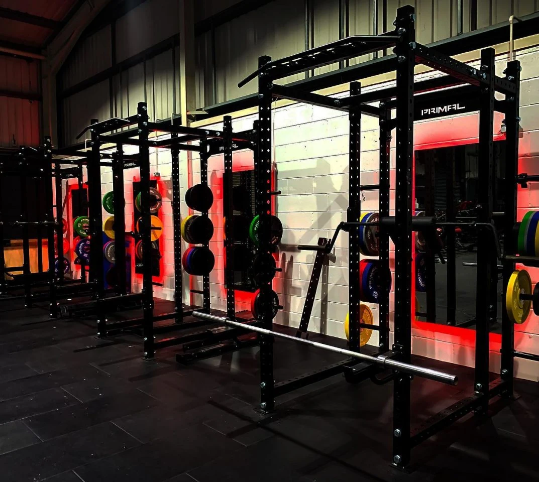 Squat racks on the gym floor at S20 Health and Fitness